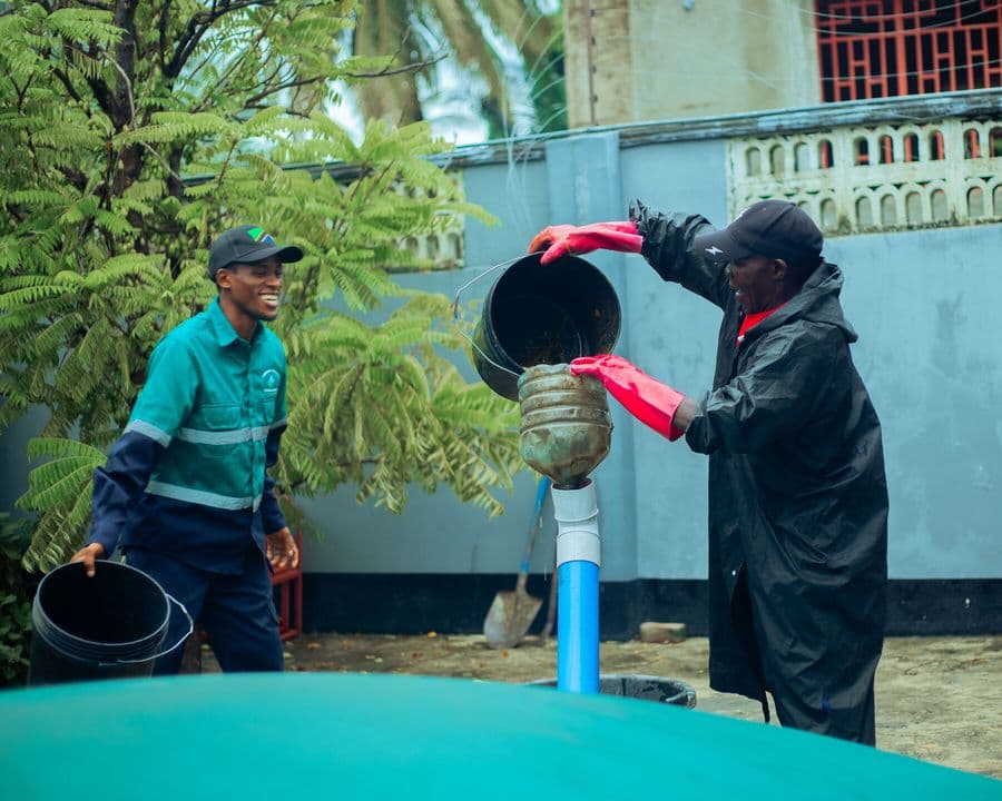 Engineers commissioning a biodigester in the field